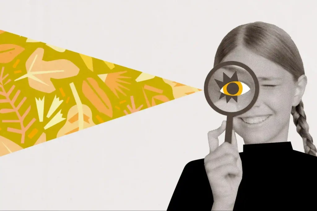 Girl holding a magnifying glass with an abstract design in the background, symbolizing curiosity and exploration.